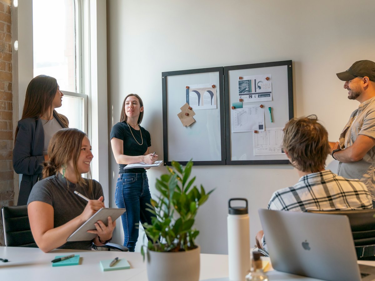 Small startup team meeting in a sunlit office
